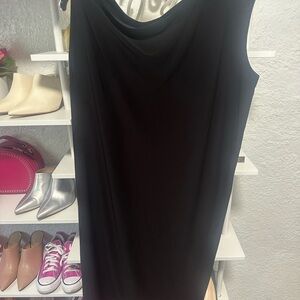 Norma Kamali off the shoulder black midi dress. It’s stunning on.